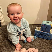 Georgie-Lee joined the competition — help win amazing prizes! baby, block, carpet, child, clothing, cute, face, foot, hand, happy, indoor, infant, mickey_mouse, months, portrait, sitting, smiling, socks, toy, young_child