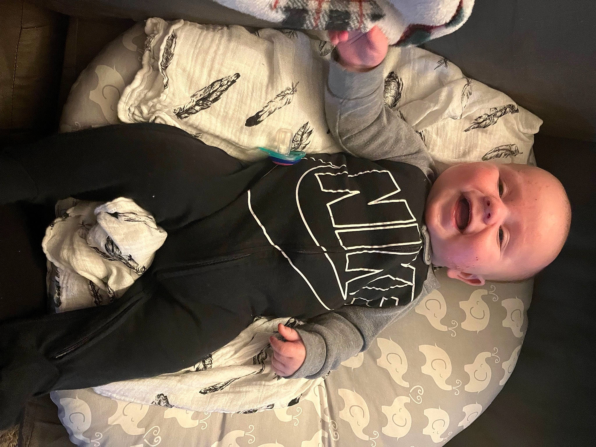 Griffin is registered to the contest to win money with this photo: baby, baby_toddler_clothing, baseball_cap, comfort, cool, elbow, facial_expression, finger, flash_photography, font, fun, hat, linens, pattern, person, sitting, sleeve, smile, sun_hat, t_shirt