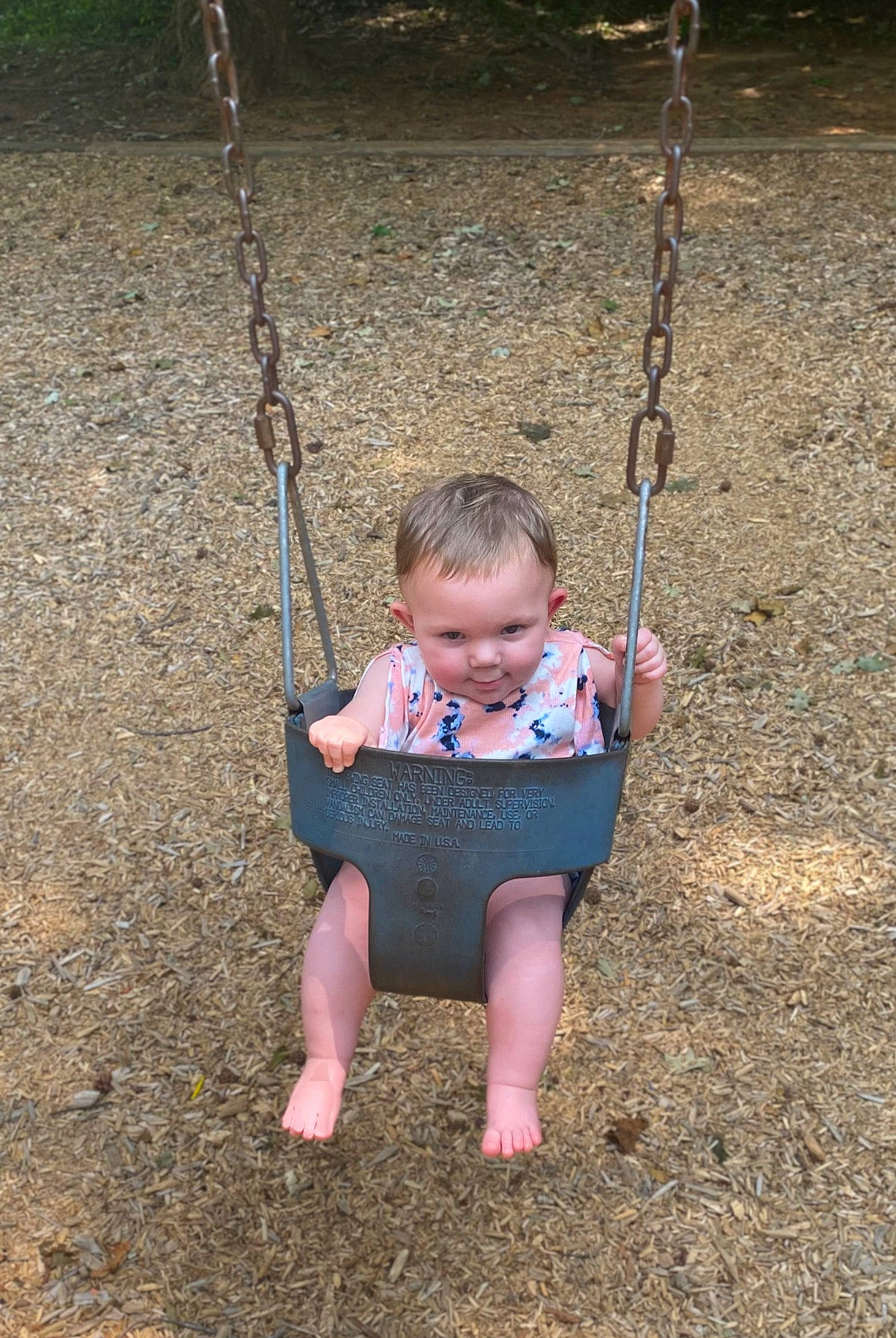 Emmerson joined the competition — help win amazing prizes! arm, baby, baby_toddler_clothing, child, city, face, fun, grass, happy, head, human_body, leisure, person, plant, playground, recreation, swing, toddler, tree, vertebrate