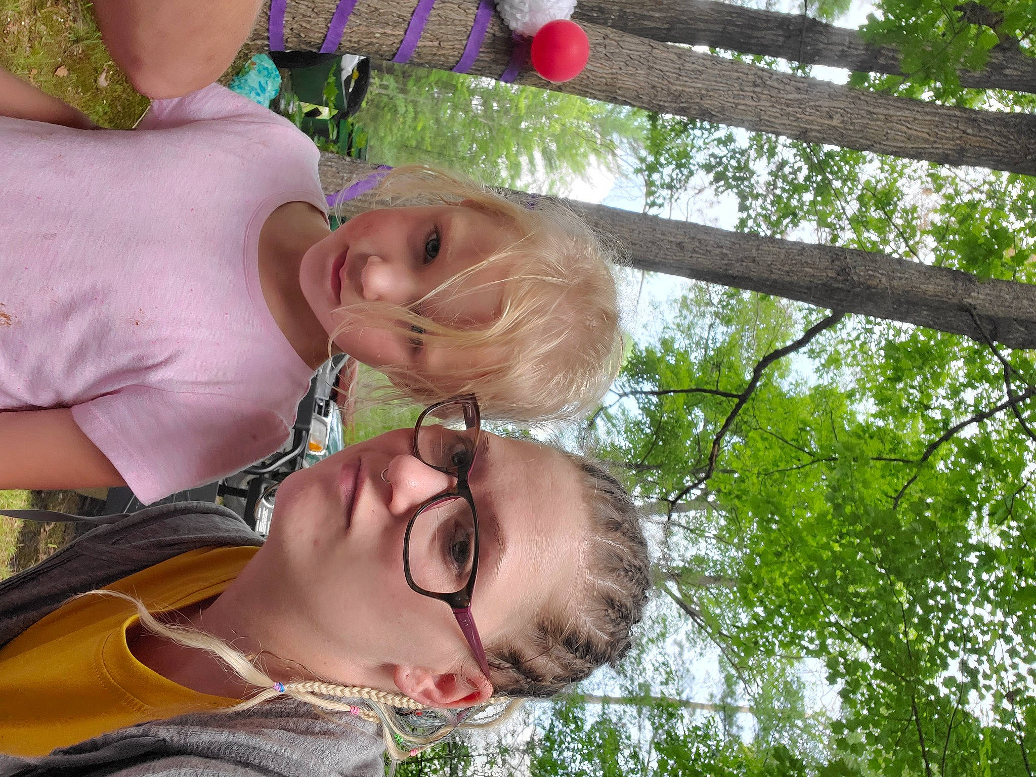 Kaya is registered to the contest to win money with this photo: baby, child, event, eyewear, fun, gesture, glasses, grass, green, happy, leisure, musical_instrument, people_in_nature, person, plant, recreation, sky, spring, sunglasses, tree