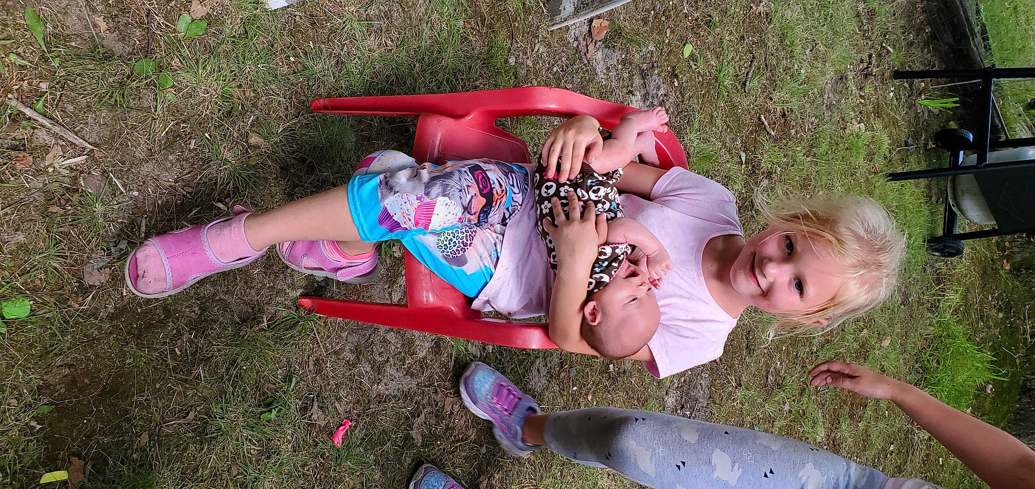 Kaya is registered to the contest to win money with this photo: baby_toddler_clothing, child, dress, face, fish, fun, grass, happy, joy, leg, leisure, people_in_nature, person, pink, plant, recreation, red, smile, spring, thigh