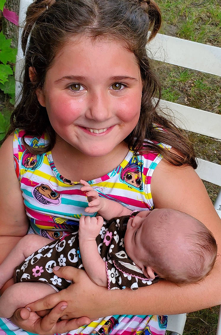 Kae-jay is registered to the contest to win money with this photo: baby_toddler_clothing, cheek, eye, face, facial_expression, grass, hair, hairstyle, happy, head, human_body, iris, joy, lip, neck, organ, people_in_nature, person, photograph, plant