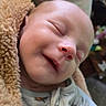 Connor joined the competition — help win amazing prizes! baby, blanket, child, closeup, clothing, cozy, cute, face, happy, head, indoor, infant, newborn, onesie, peaceful, portrait, relaxed, sleeping, smiling, soft