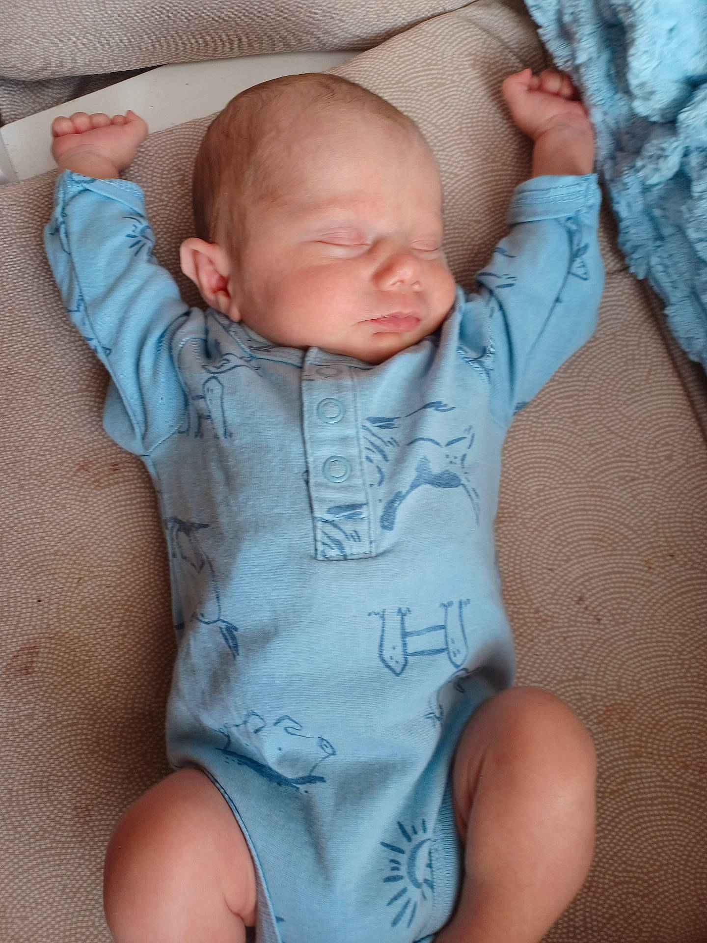 Isaac is registered to the contest to win money with this photo: arms_up, baby, blanket, blue_onesie, child, comfort, cozy, cute, face, hands, indoors, infant, legs, newborn, peaceful, rest, skin, sleeping, soft, texture