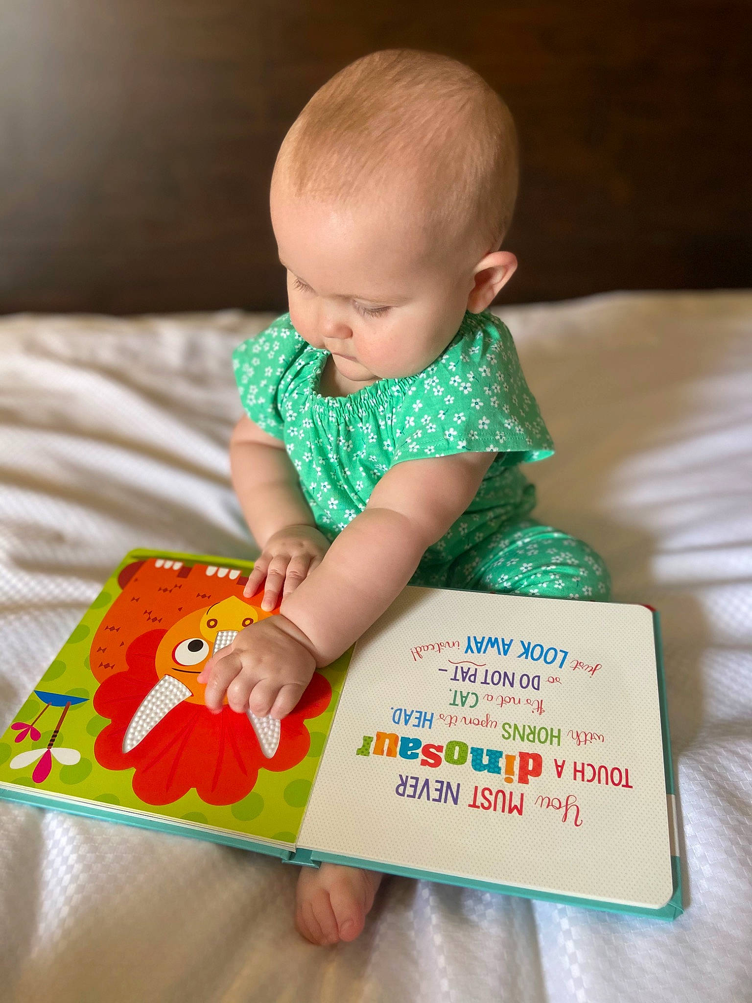 Madelyn is registered to the contest to win money with this photo: arm, baby, baby_playing_with_toys, baby_products, baby_toddler_clothing, child, comfort, finger, grass, hand, happy, head, human_body, nail, orange, person, play, room, skin, toddler