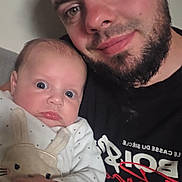 Horia a rejoint le concours — aidez-le/la à gagner de superbes lots ! baby, man, beard, face, portrait, child, clothing, pajamas, cute, indoor, person, expression, skin, hand, head, closeup, family, togetherness, casual, love