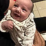 Horia participe au concours pour gagner de l'argent avec cette photo : baby, infant, smile, face, person, clothing, onesie, arm, hand, skin, happy, indoor, floor, tile, background, holding, cute, expression, child, newborn