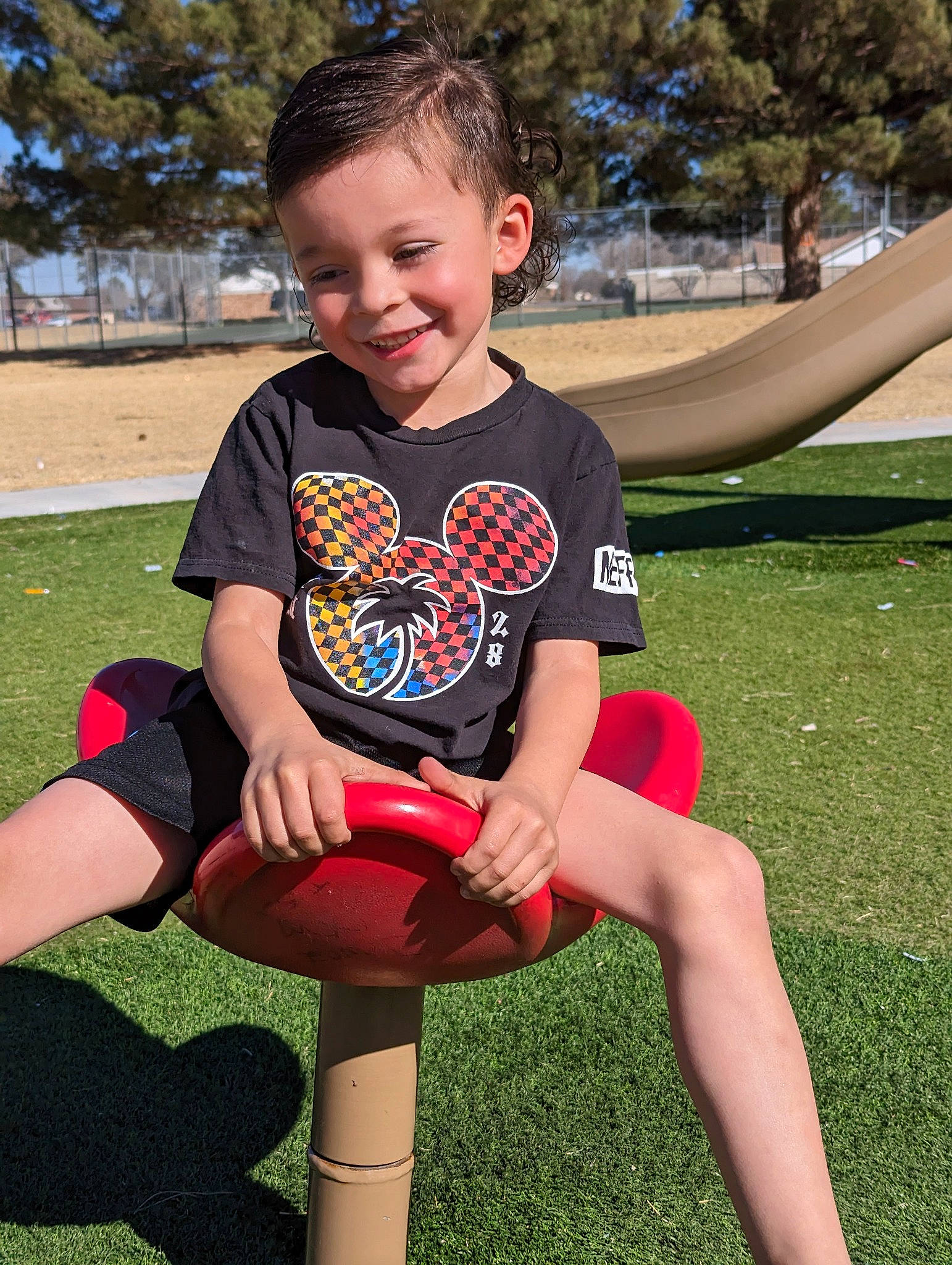 Graysen is registered to the contest to win money with this photo: arm, child, fun, grass, hairstyle, happy, human_body, human_leg, joy, knee, leg, leisure, people_in_nature, person, recreation, shorts, sleeve, smile, t_shirt, thigh