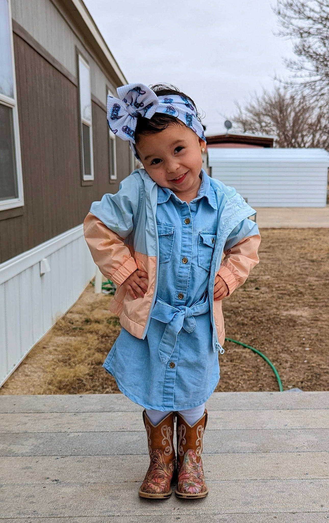 Riley is registered to the contest to win money with this photo: blazer, collar, denim, dress, dress_shirt, electric_blue, face, fashion_accessory, fashion_design, footwear, formal_wear, happy, hat, headwear, joy, pattern, person, sky, sleeve, smile