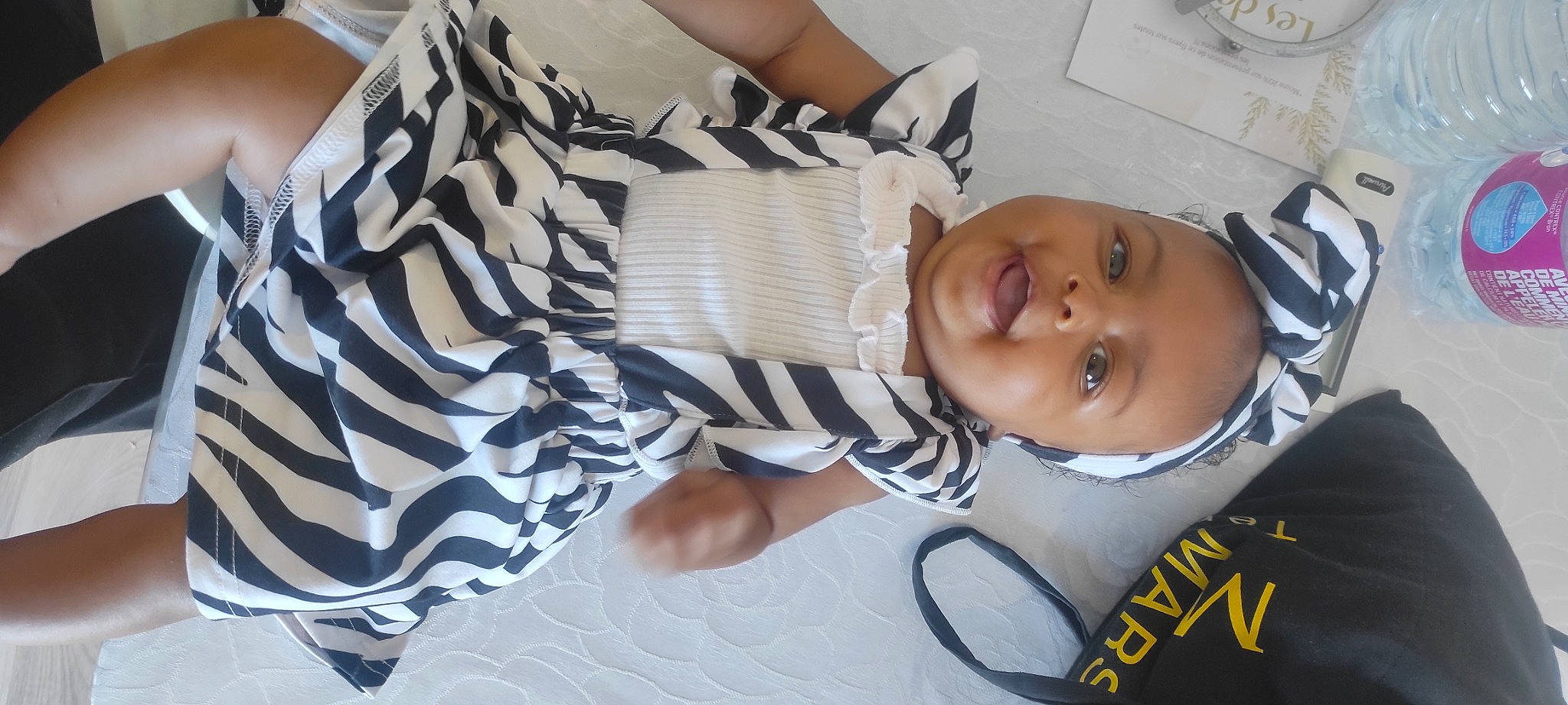 Aaliyah participe au concours pour gagner de l'argent avec cette photo : baby, baby_products, baby_toddler_clothing, cheek, child, comfort, eyelash, eyewear, fashion_accessory, flag_of_the_united_states, happy, headgear, linens, pattern, person, sitting, sleeve, smile, thigh, toddler