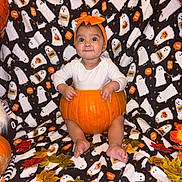 Amriah Jasmine joined the competition — help win amazing prizes! baby, pumpkin, headband, orange, halloween, ghost_pattern, blanket, autumn_leaves, fall, cute, infant, festive, costume, sitting, child, smile, holiday, decor, seasonal, indoors