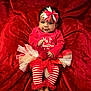 baby, infant, red_clothing, headband, bow, striped_leggings, christmas, holiday, tutu, plush_blanket, cute, smiling, portrait, indoors, festive, child, toddler, feet, happy, celebration