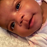 Ki'Mani joined the competition — help win amazing prizes! baby, infant, face, smile, eyes, skin, blanket, close_up, portrait, cute, child, lying_down, soft_texture, expression, newborn, human, person, indoors, head, happy