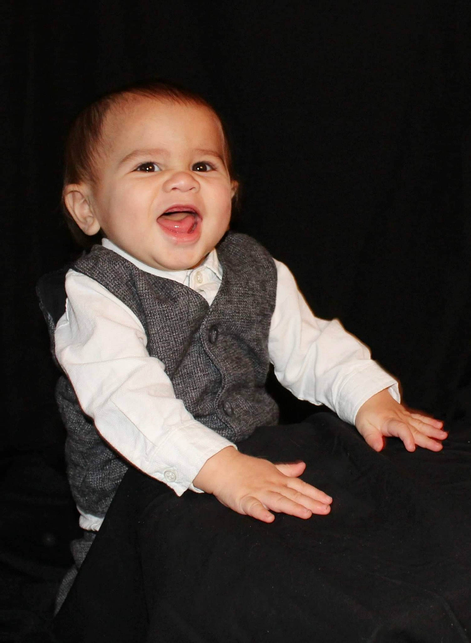 Alec is registered to the contest to win money with this photo: baby, baby_toddler_clothing, cheek, child, child_model, collar, comfort, finger, flash_photography, gesture, hand, iris, organ, person, product, skin, sleeve, standing, thumb, toddler