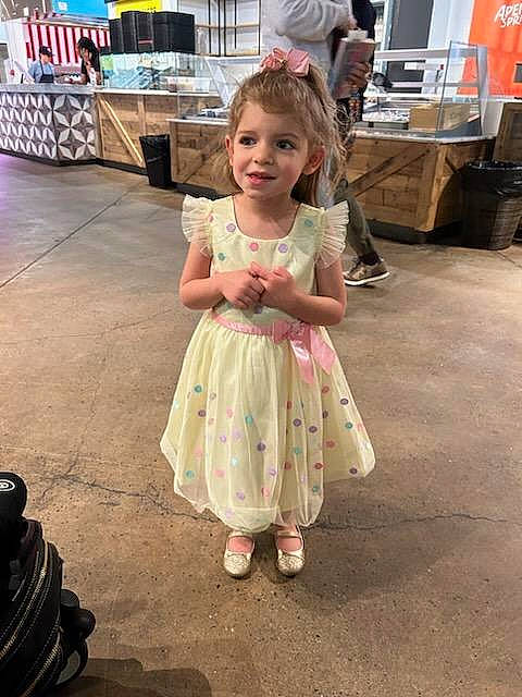 Marissa is registered to the contest to win money with this photo: child, costume, dress, event, fashion_design, flooring, footwear, fun, happy, joy, leg, leisure, person, recreation, sandal, shoe, smile, toddler, tradition, walking