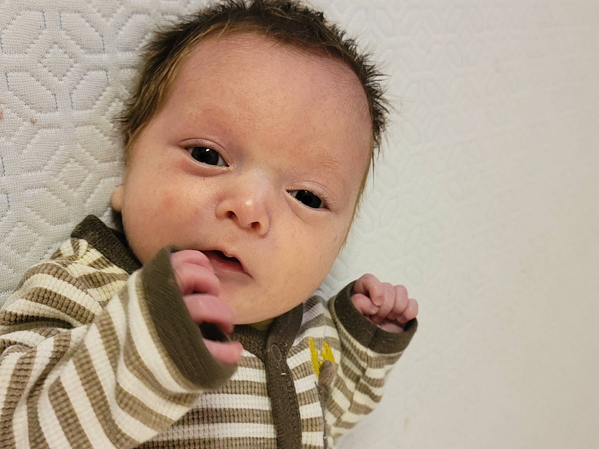 Christopher is registered to the contest to win money with this photo: baby, baby_toddler_clothing, cheek, collar, ear, eyebrow, eyelash, face, finger, gesture, hand, happy, iris, lip, nose, person, shirt, skin, sleeve, thumb