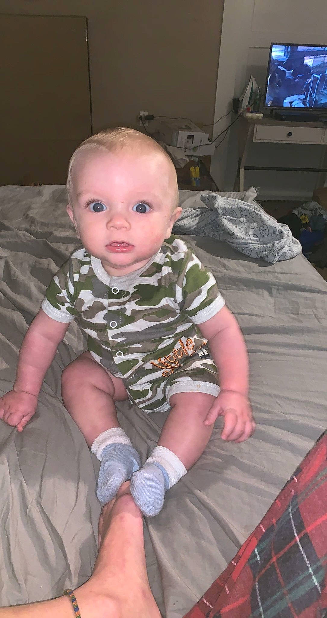 Tracy joined the competition — help win amazing prizes! baby, baby_toddler_clothing, cheek, child, chin, comfort, finger, flooring, iris, knee, lap, pattern, person, pink, plaid, sitting, skin, sleeve, tartan, television