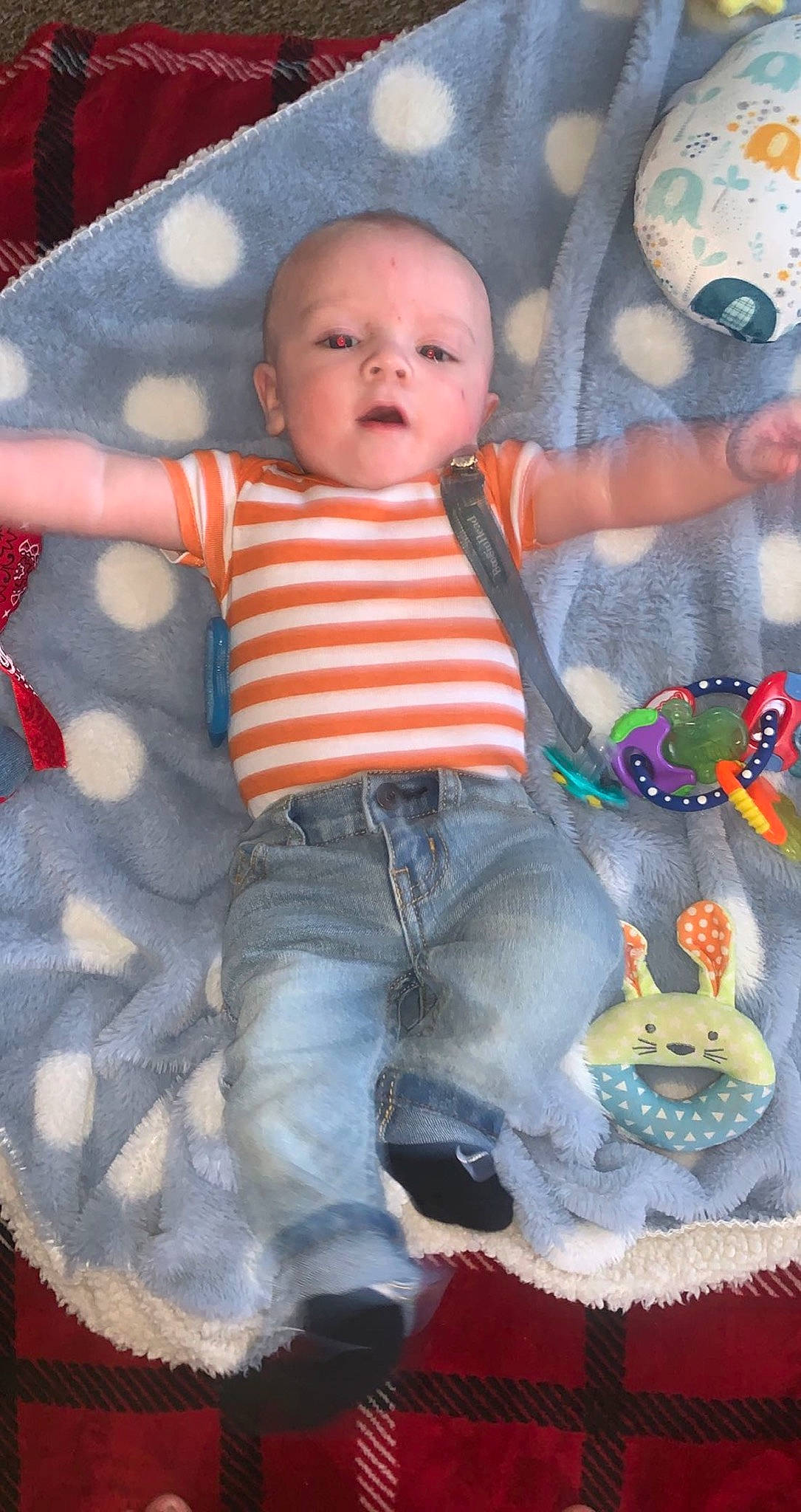 Tracy is registered to the contest to win money with this photo: baby, baby_products, baby_toddler_clothing, cheek, child, eye, finger, fun, hand, human_body, mouth, pattern, person, pink, sitting, skin, sleeve, t_shirt, textile, toddler