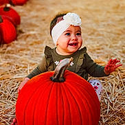 Ellie joined the competition — help win amazing prizes! baby, child, pumpkin, headband, flower, smiling, straw, fall, autumn, orange, cute, sitting, outdoor, harvest, holiday, seasonal, happy, person, portrait, festival