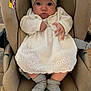 Luna a rejoint le concours — aidez-le/la à gagner de superbes lots ! baby, infant, car_seat, headband, flower, white_dress, socks, wooden_floor, indoors, child, cute, seated, young, looking_at_camera, clothing, fabric, padded_seat, person, baby_accessories, comfort
