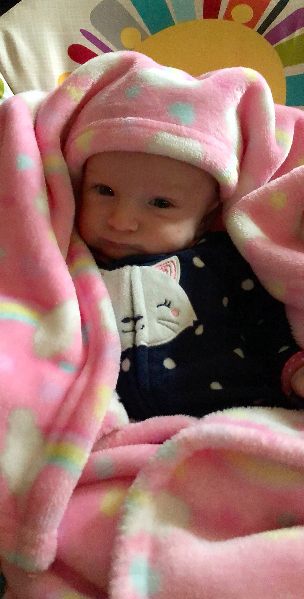 Jacey is registered to the contest to win money with this photo: cheek, child, eye, finger, girl, hand, headwear, infant, lip, mouth, person, pink, product, skin, toddler, toy