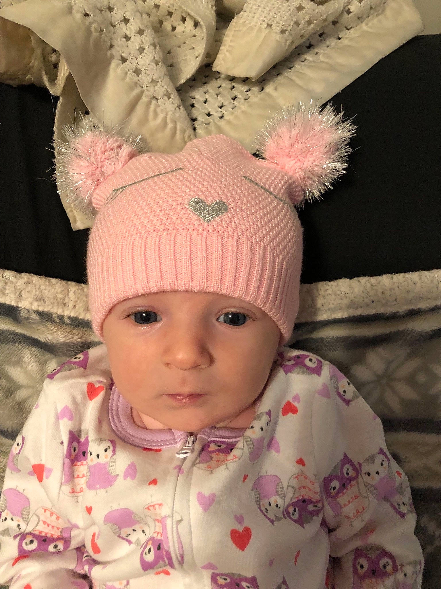 Jacey is registered to the contest to win money with this photo: beanie, bonnet, cap, cheek, child, ear, girl, hair_accessory, hat, head, headgear, infant, knit_cap, knitting, person, pink, product, skin, smile, textile
