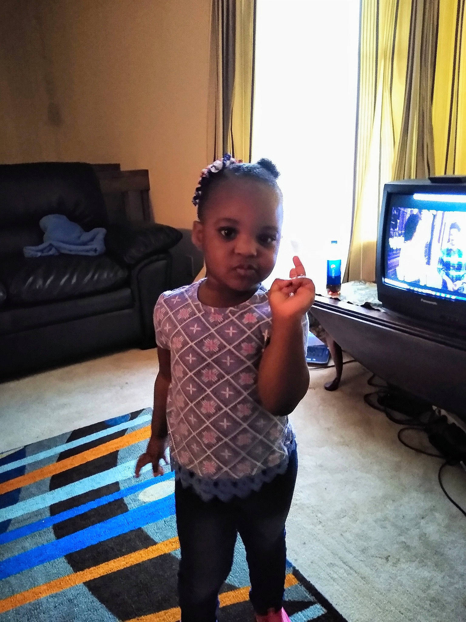 Tori is registered to the contest to win money with this photo: arm, child, design, electronic_device, floor, flooring, gadget, joint, leg, media, person, play, room, shoulder, standing, technology, television, toddler