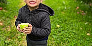 Mateo joined the competition — help win amazing prizes! adult, apple, boy, child, clothing, coat, face, food, fruit, grass, head, jacket, male, man, pants, person, photography, plant, portrait, produce