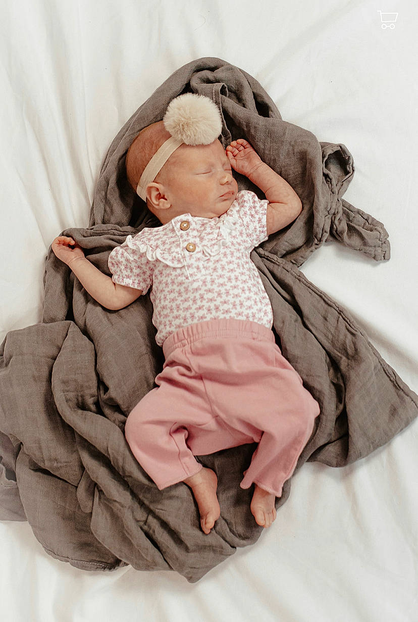 Natalie joined the competition — help win amazing prizes! baby, baby_products, baby_sleeping, baby_toddler_clothing, beanie, bedding, child, comfort, foot, fur, hand, linens, pattern, person, pink, portrait_photography, sitting, sleeve, sock, textile