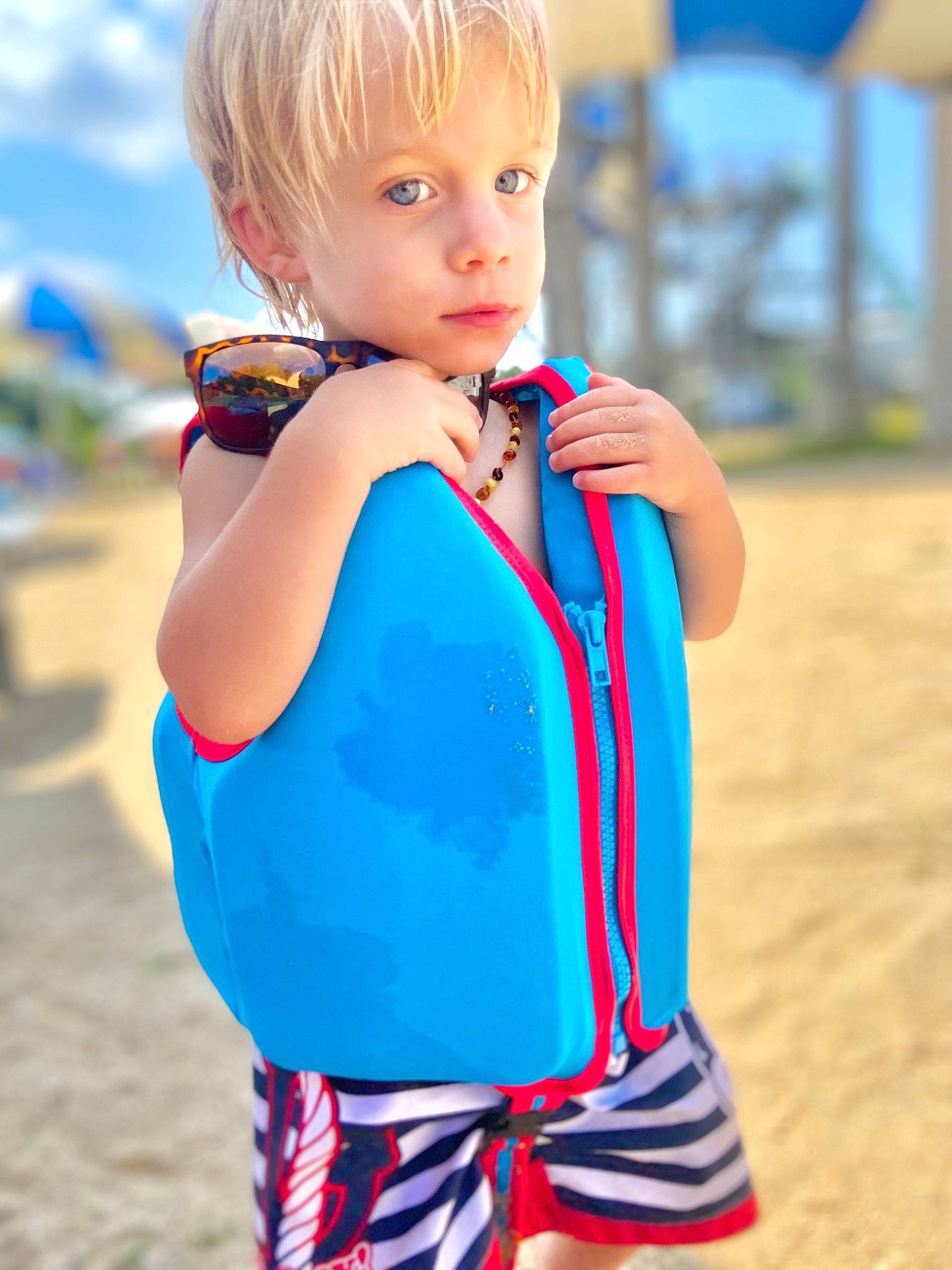 Jameson is registered to the contest to win money with this photo: baby_toddler_clothing, blond, child, cool, electric_blue, face, fun, gesture, hairstyle, happy, leisure, neck, people, person, recreation, shoulder, sky, sleeve, summer, t_shirt