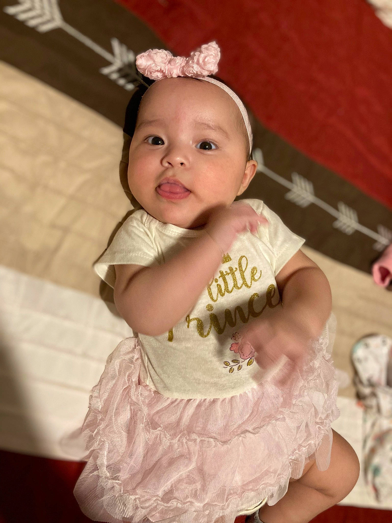 Karina is registered to the contest to win money with this photo: baby, baby_toddler_clothing, child, costume_hat, day_dress, dress, embellishment, event, fashion_accessory, flash_photography, happy, headband, headpiece, jewellery, magenta, pattern, person, pink, sleeve, smile