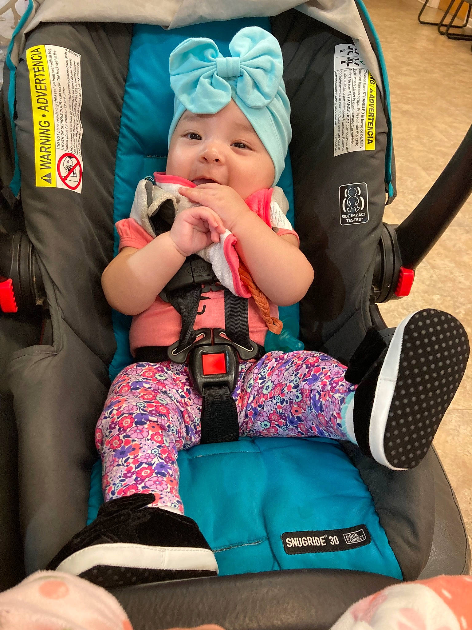 Karina joined the competition — help win amazing prizes! baby, baby_carriage, baby_products, baby_toddler_clothing, bag, blue, car_seat, child, comfort, fun, green, headwear, human_leg, knee, lap, leisure, person, product, sitting, sock