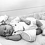baby, sleeping, infant, overalls, socks, crib, blanket, soft, peaceful, resting, monochrome, portrait, child, newborn, cute, cozy, relaxed, indoor, clothing, babywear