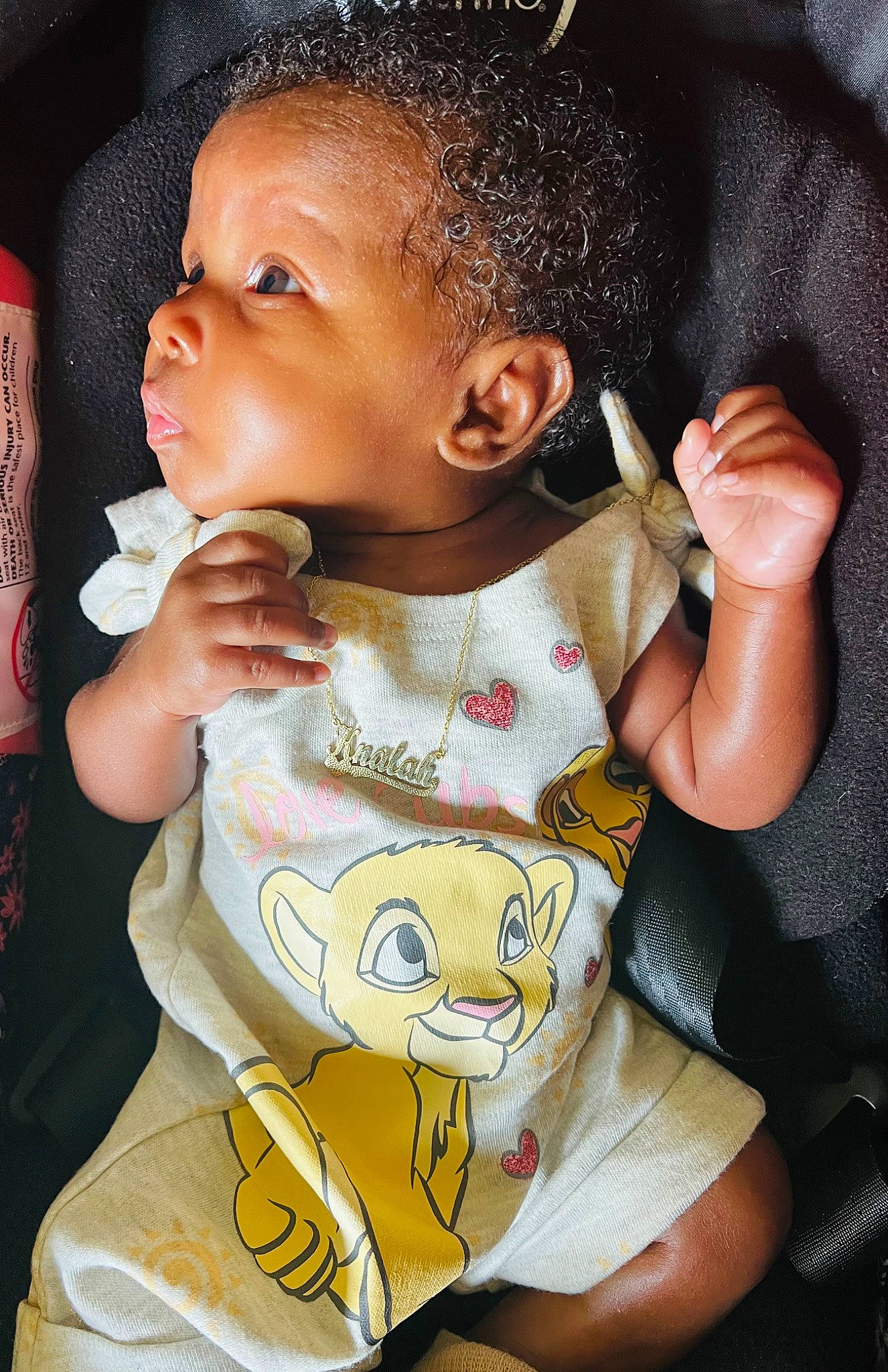 Knalah is registered to the contest to win money with this photo: baby, baby_toddler_clothing, bib, black_hair, cheek, child, ear, eyelash, finger, fun, gesture, happy, head, lip, neck, nose, person, skin, sleeve, thumb