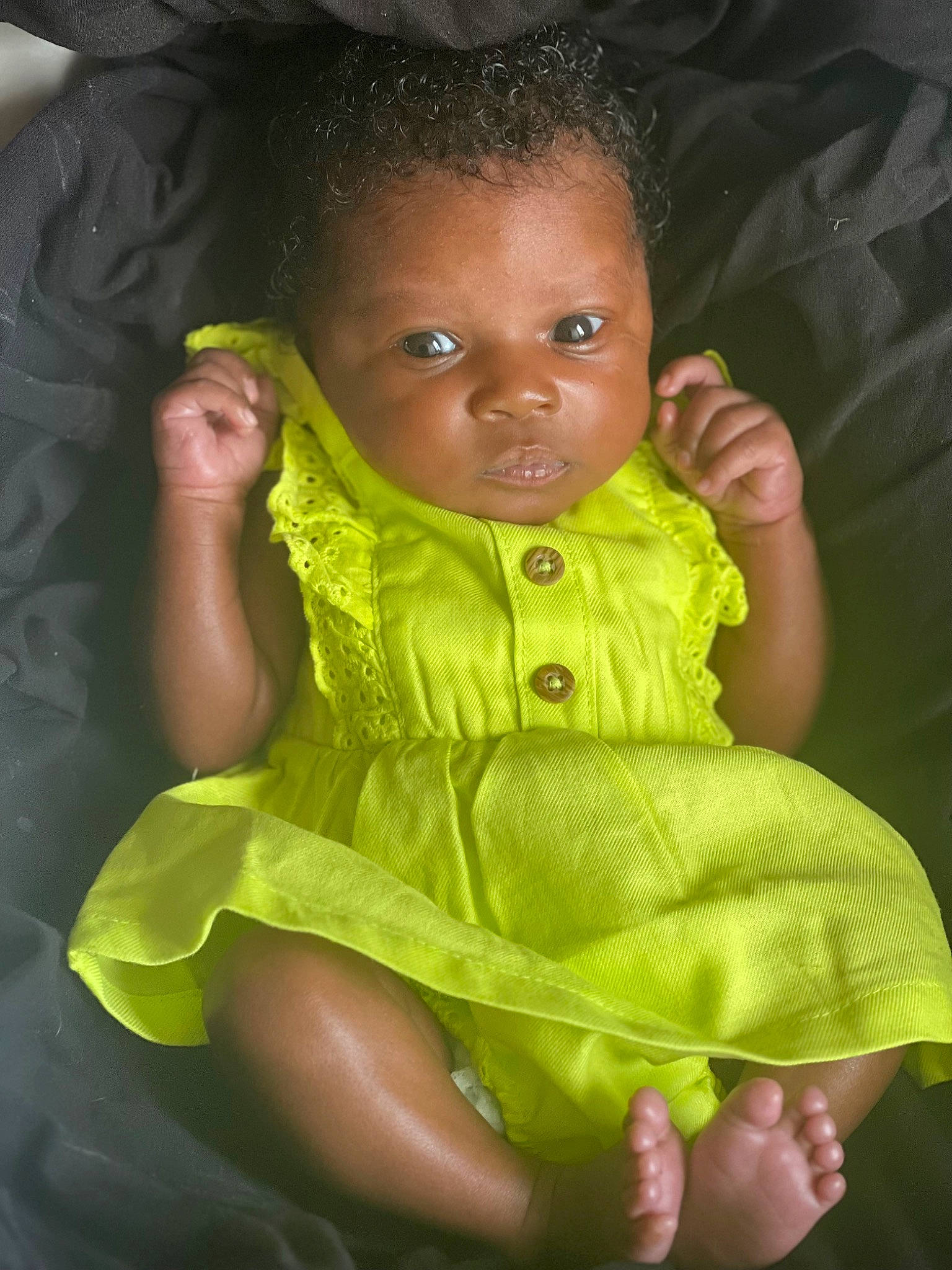 Knalah is registered to the contest to win money with this photo: adaptation, baby, baby_toddler_clothing, cheek, child, dress, eye, flash_photography, fun, gesture, grass, happy, head, iris, lip, nose, person, sitting, skin, sleeve