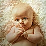 baby, infant, child, face, hands, skin, fluffy_blanket, lying_down, cute, portrait, expression, curious, closeup, naked_torso, soft_texture, young, newborn, indoors, peaceful, adorable