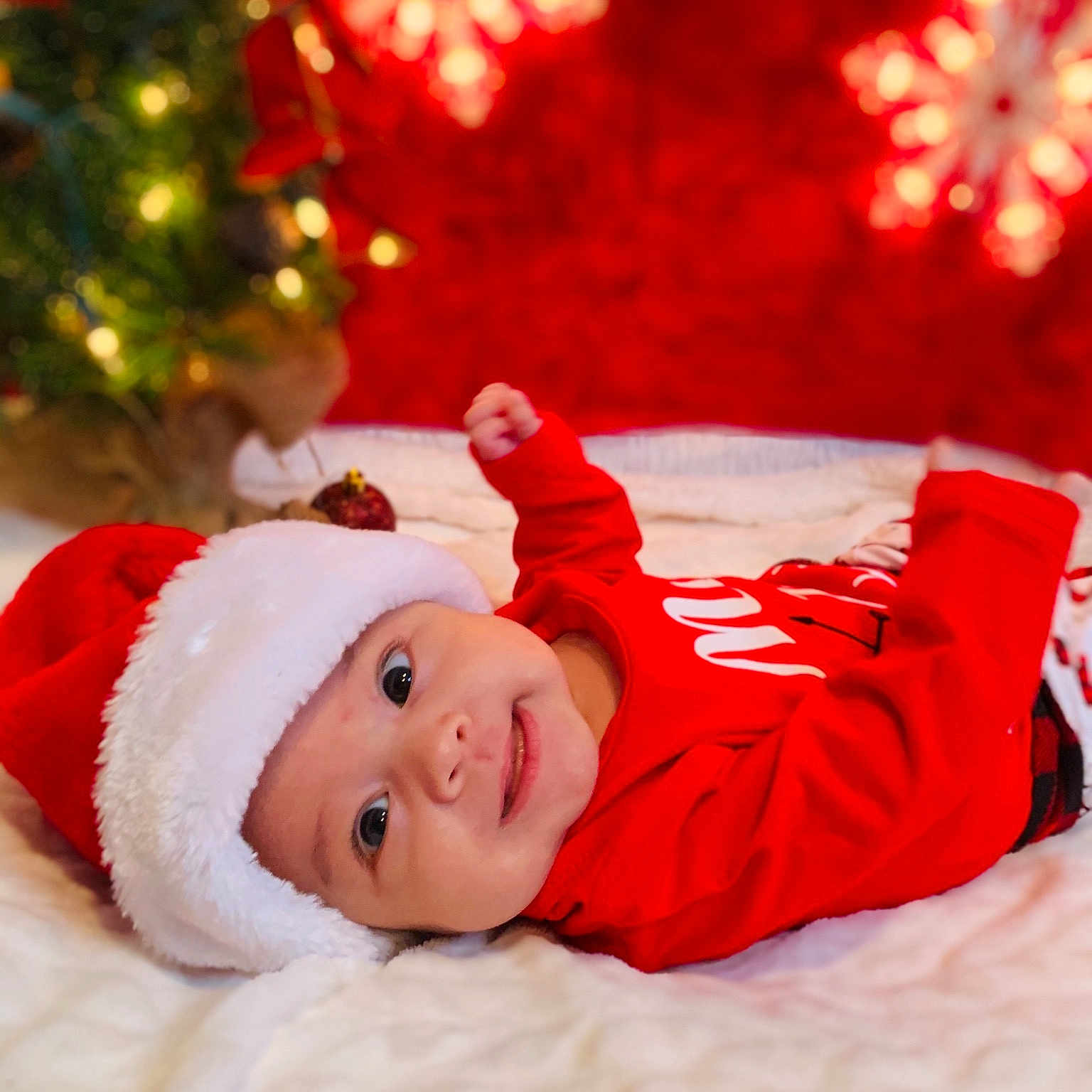 Jalen is registered to the contest to win money with this photo: baby, child, christmas, christmas_decoration, christmas_eve, christmas_ornament, fictional_character, holiday, red, santa_claus, toddler