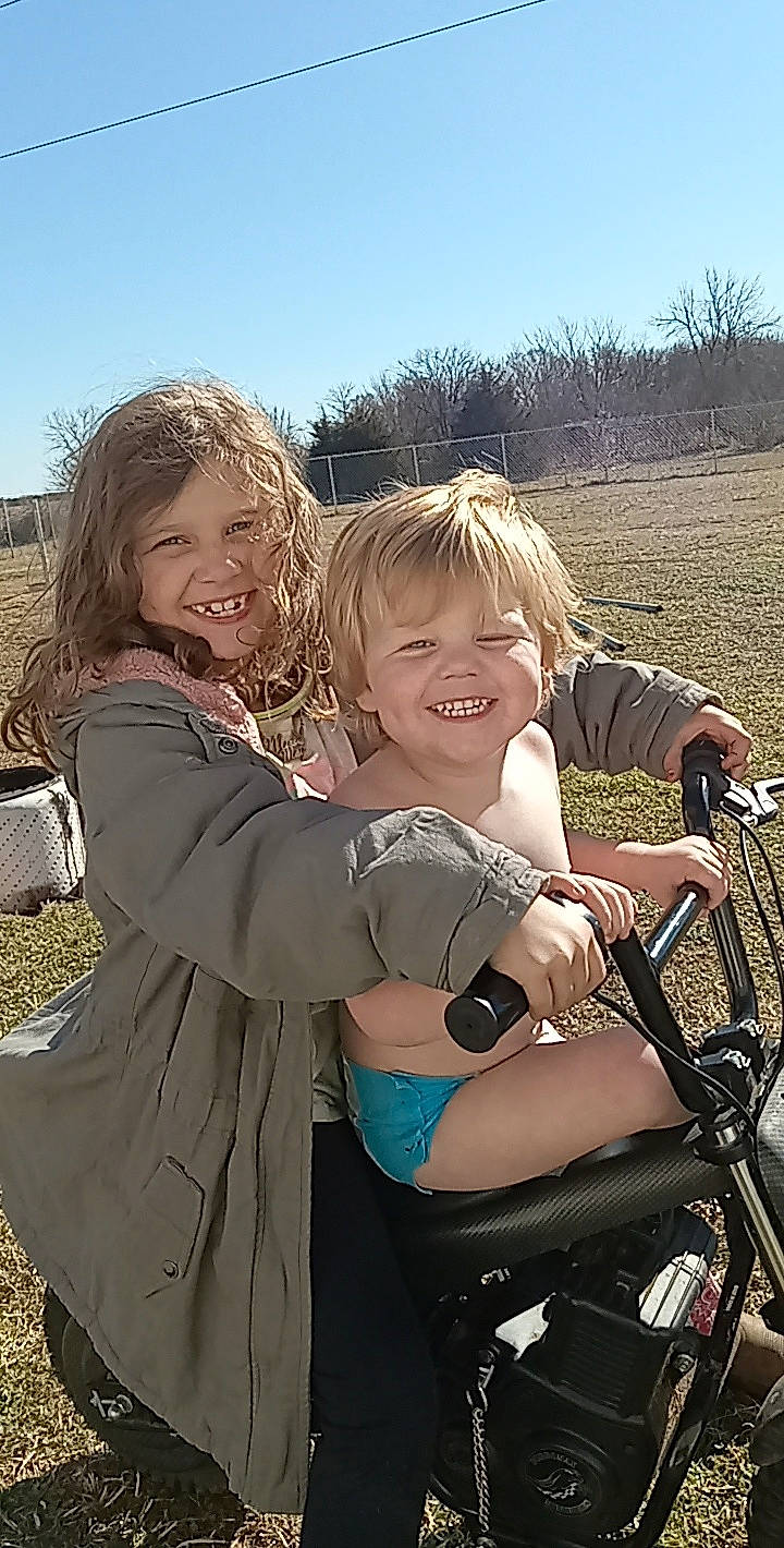 Raven joined the competition — help win amazing prizes! baby_carriage, bicycle_handlebar, blond, fun, gesture, grass, grassland, happy, iris, joy, landscape, leisure, motor_vehicle, people_in_nature, person, recreation, sky, smile, spoke, toddler