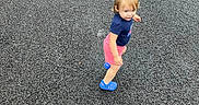 Brianna joined the competition — help win amazing prizes! asphalt, backpack, blue_shoes, casual, child, curious_expression, daytime, grass, nature, outdoor, pink_shorts, puddle, road, shoes, shorts, summer_clothing, toddler, two_children, walking, walking_away