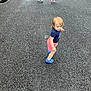 asphalt, backpack, blue_shoes, casual, child, curious_expression, daytime, grass, nature, outdoor, pink_shorts, puddle, road, shoes, shorts, summer_clothing, toddler, two_children, walking, walking_away