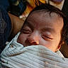 baby, sleeping, blanket, face, infant, child, closeup, soft_light, peaceful, wrapped, hair, skin, portrait, newborn, cozy, indoors, resting, cute, toddler, human