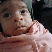 Katie is registered to the contest to win money with this photo: baby, blanket, child, closeup, clothing, cute, expression, eyes, face, head, indoors, infant, person, pink, portrait, skin, soft, warm, wrapped, young