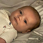 Kaleio joined the competition — help win amazing prizes! baby, infant, face, person, sleepwear, bed, blanket, lying_down, closeup, cute, child, young, soft_lighting, indoors, portrait, sleepy, calm, skin, head, expression