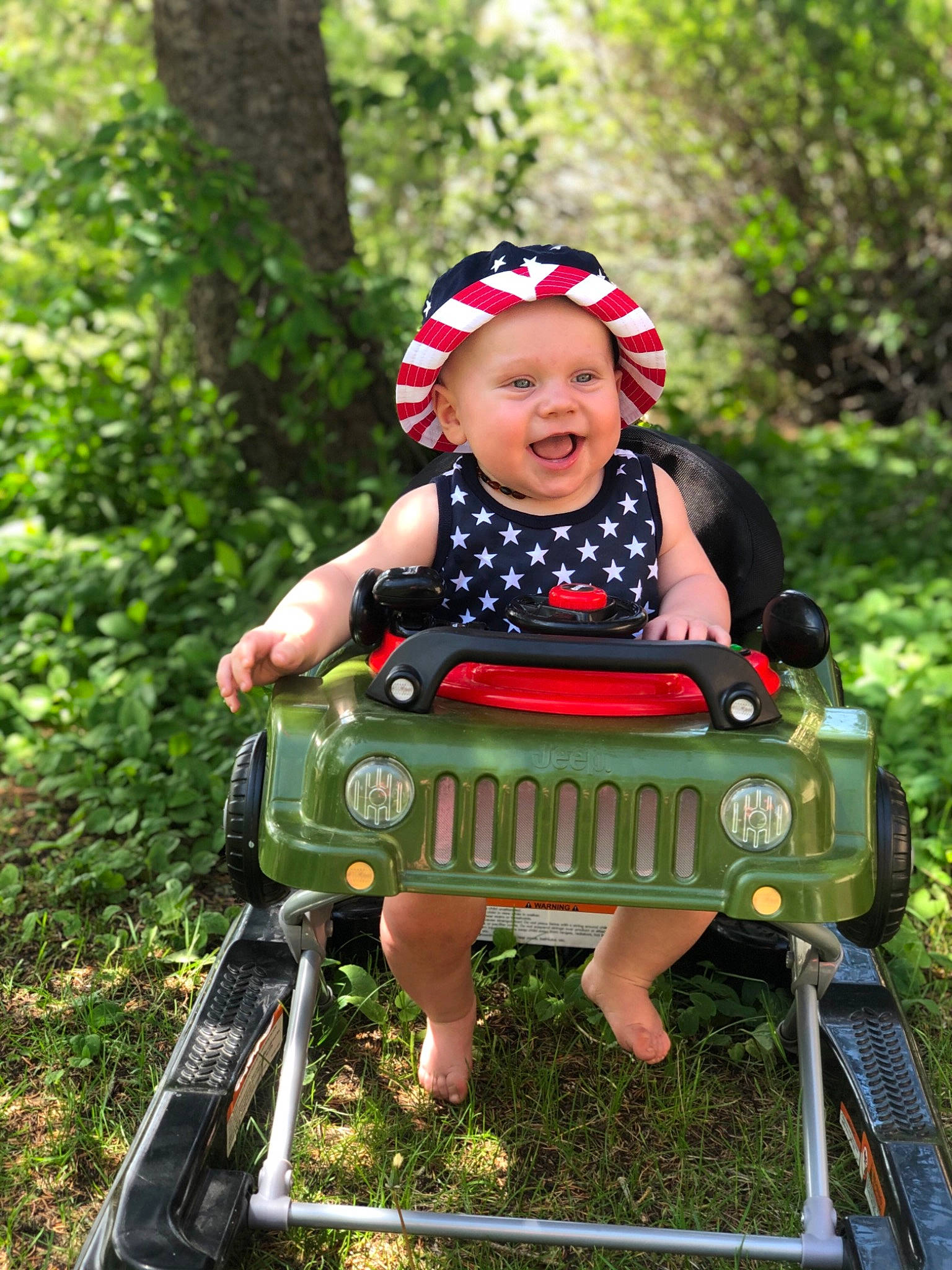 Karsyn is registered to the contest to win money with this photo: child, grass, headwear, person, play, toddler, vehicle