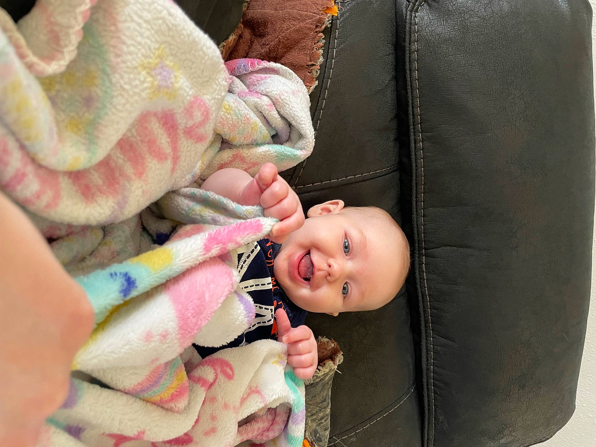 Archer is registered to the contest to win money with this photo: baby, baby_products, baby_toddler_clothing, cheek, child, comfort, face, gesture, hand, happy, linens, nail, nose, person, photograph, pink, skin, sleeve, smile, thumb