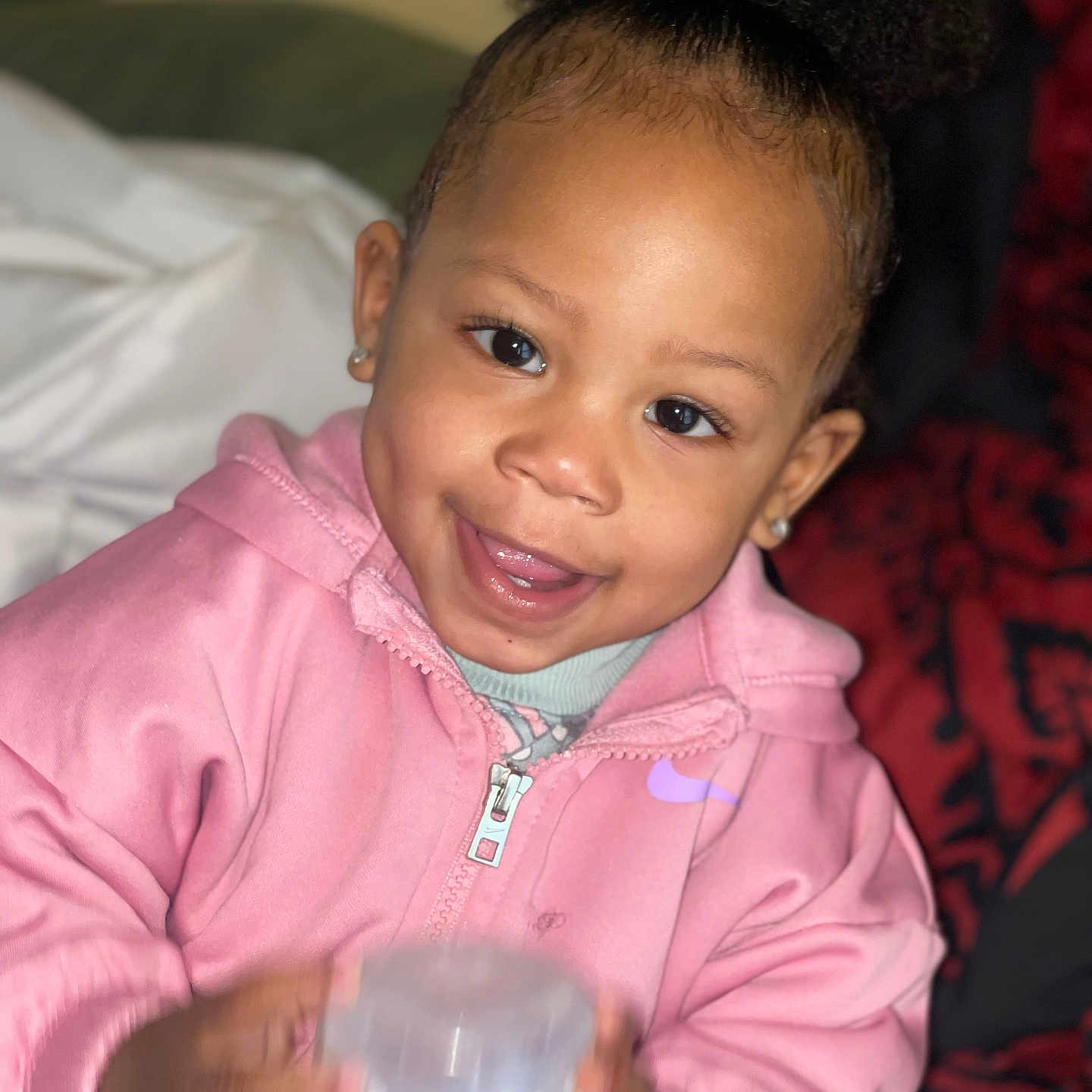 Denver is registered to the contest to win money with this photo: baby, babylaughing, bodypart, clothing, coat, couch, face, finger, furniture, hair, hand, happy, head, jacket, mouth, person, photography, portrait, sitting, smile