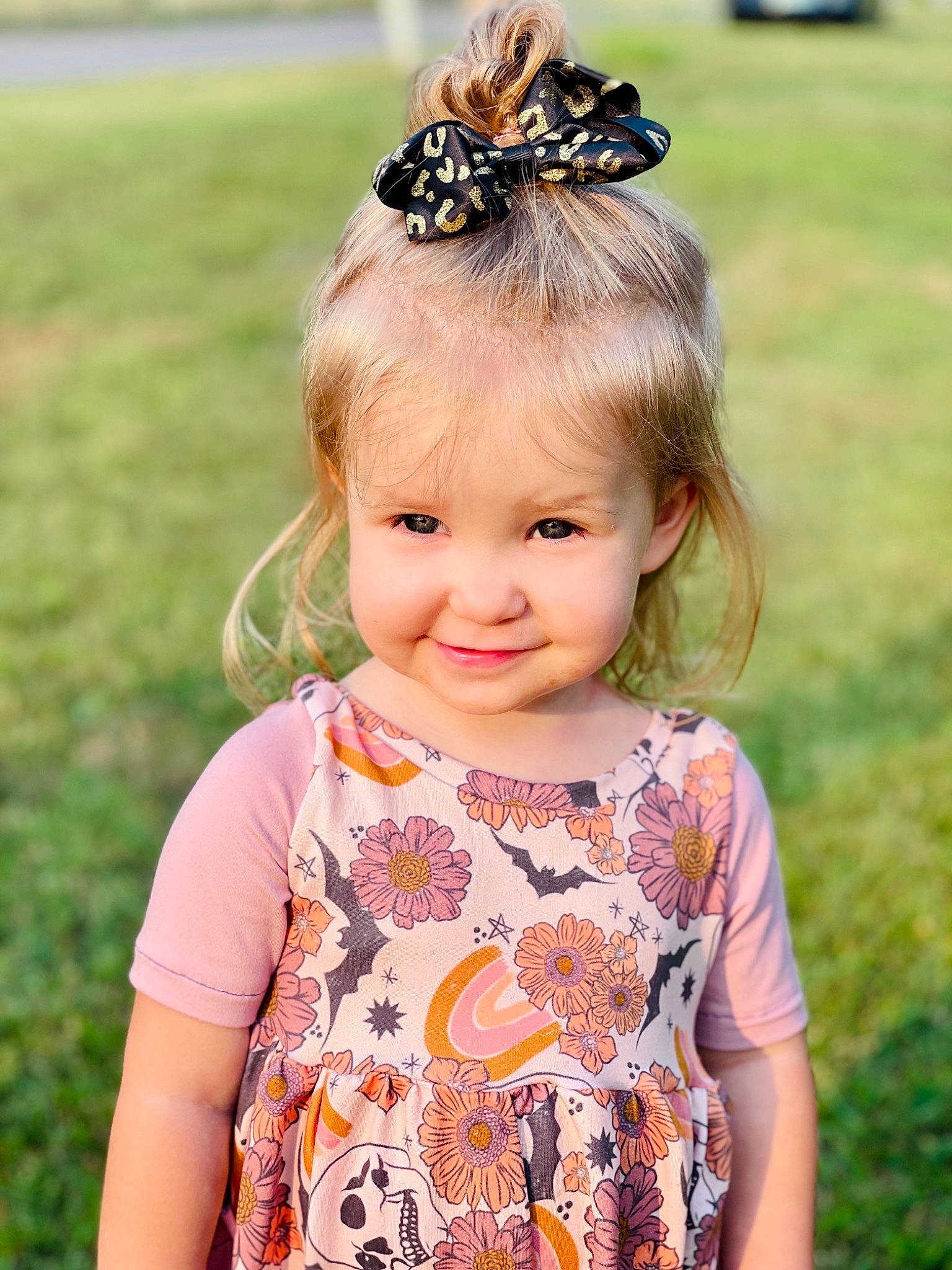 Meredith joined the competition — help win amazing prizes! baby_toddler_clothing, botany, clothing, dress, eye, facial_expression, grass, happy, headpiece, insect, iris, joy, people_in_nature, person, pink, plant, skin, sleeve, smile, summer