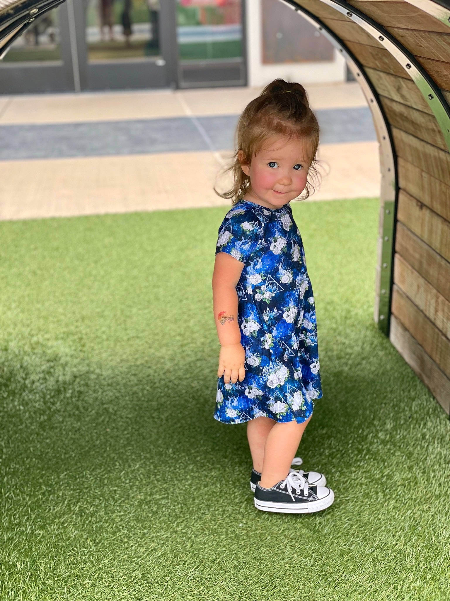 Meredith is registered to the contest to win money with this photo: child, city, dress, electric_blue, flooring, fun, grass, green, happy, joy, lawn, leg, leisure, people_in_nature, person, plant, recreation, sleeve, standing, street_fashion