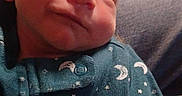 Hunter joined the competition — help win amazing prizes! newborn, baby, sleeping, smile, onesie, moon, stars, cozy, arm, person, indoor, fabric, clothing, closeup, infant, cute, resting, child, portrait, peaceful