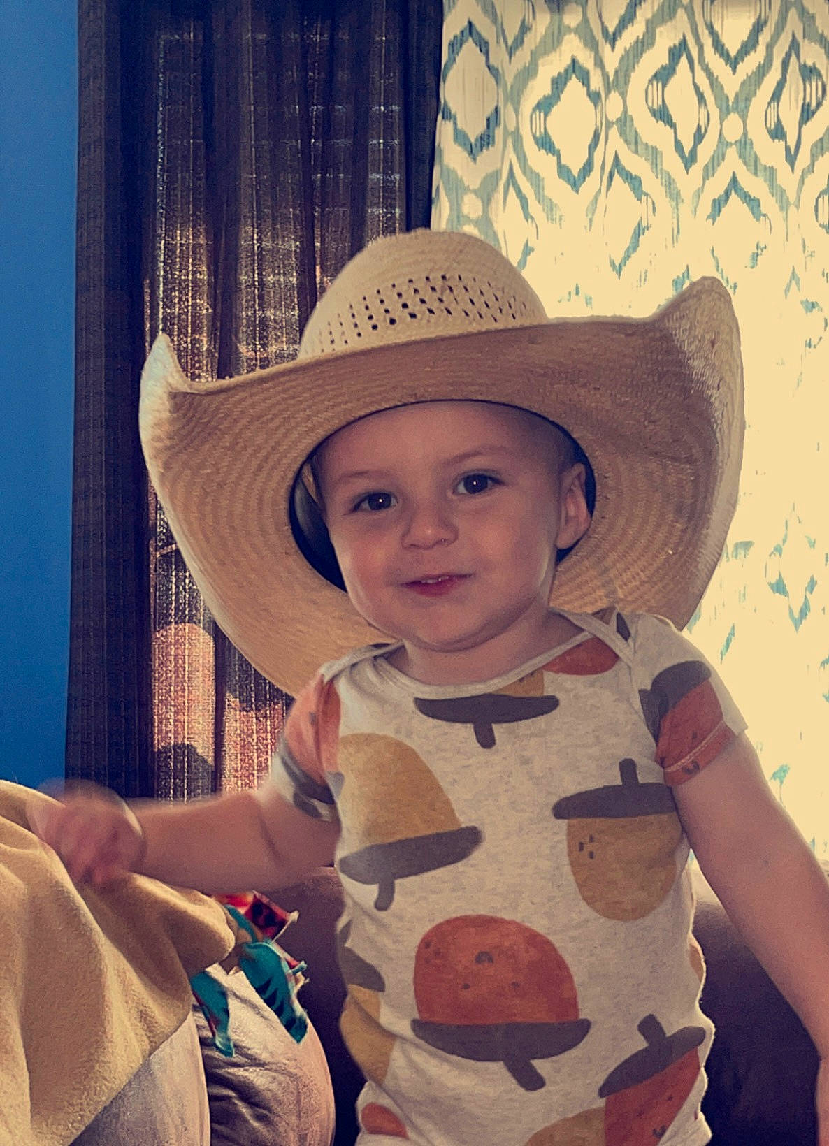 Roan is registered to the contest to win money with this photo: baby_toddler_clothing, blond, blue, chin, cool, facial_expression, fashion_accessory, fun, hairstyle, happy, hat, head, headgear, headwear, iris, joy, lip, pattern, person, sleeve